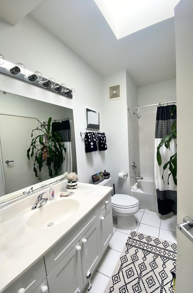 full bathroom with tile patterned flooring, vanity, shower / tub combo with curtain, and toilet