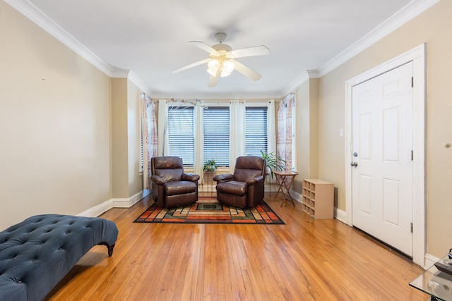 sitting room with crown molding, ceiling fan, and light hardwood / wood-style flooring