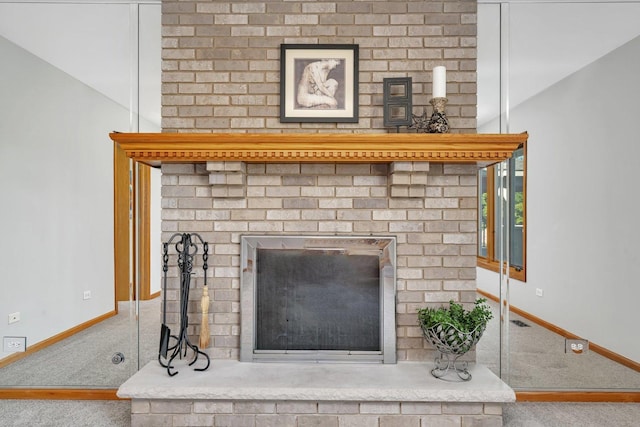 details featuring carpet and a brick fireplace