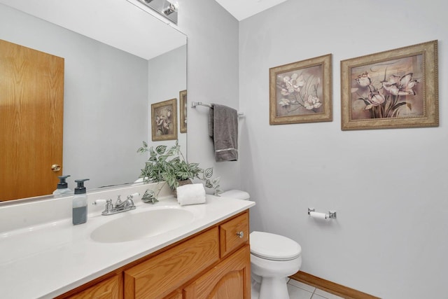 bathroom with vanity, toilet, and tile patterned flooring