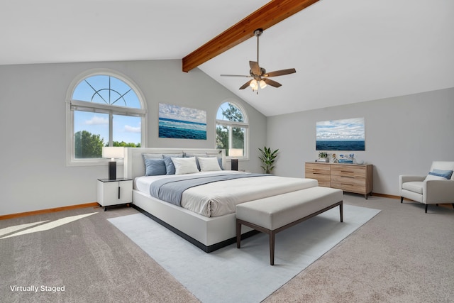 carpeted bedroom with vaulted ceiling with beams and ceiling fan