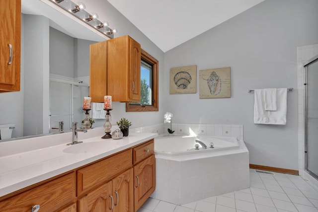 bathroom with lofted ceiling, vanity, tile patterned floors, and shower with separate bathtub