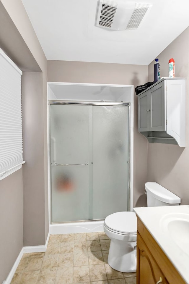 bathroom with vanity, toilet, and walk in shower