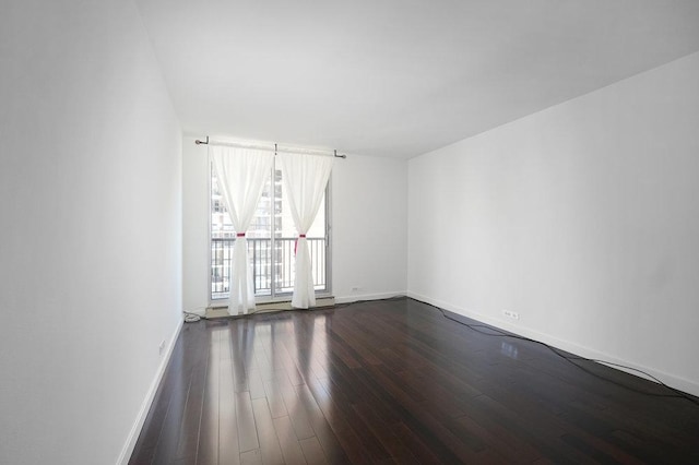 spare room featuring hardwood / wood-style flooring