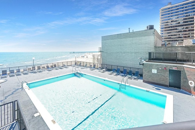 view of pool featuring a water view