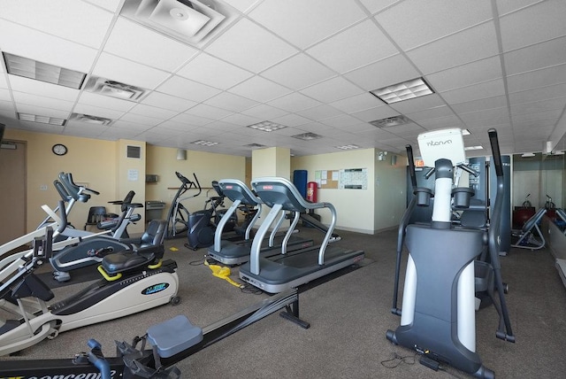 workout area with a paneled ceiling