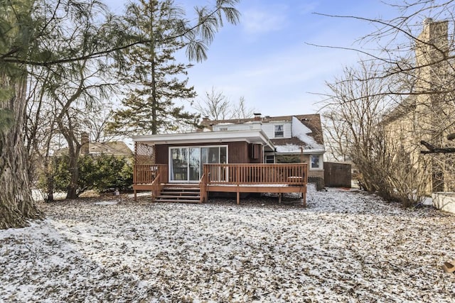 snow covered property featuring a deck