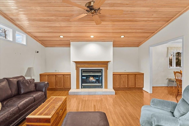 living room featuring crown molding, lofted ceiling, light wood-type flooring, and wooden ceiling