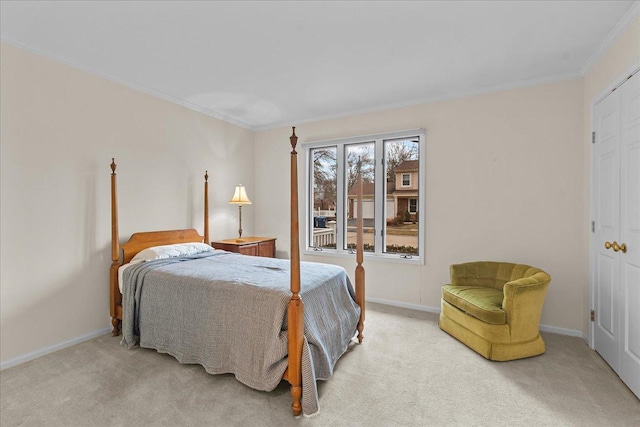 bedroom with crown molding and carpet flooring