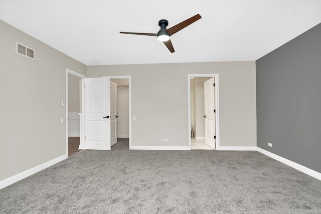 unfurnished bedroom with light carpet and ceiling fan