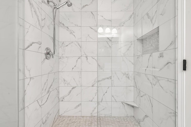 bathroom featuring tiled shower