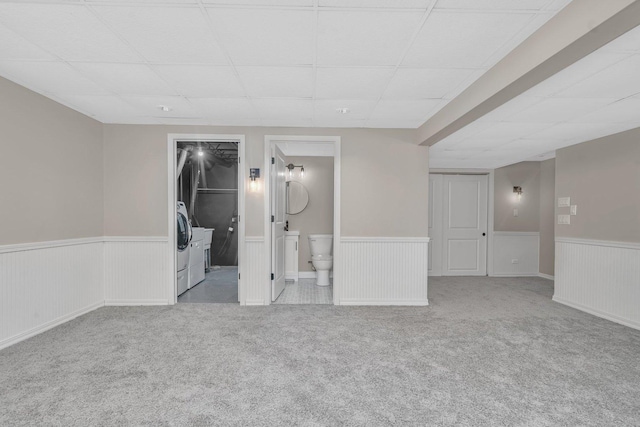 carpeted empty room featuring a paneled ceiling