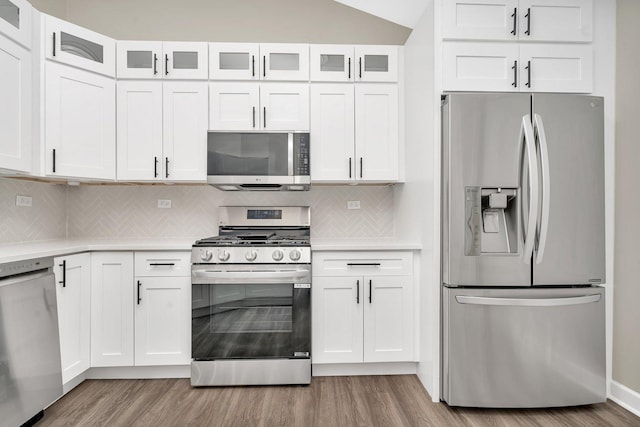 kitchen featuring light hardwood / wood-style floors, white cabinets, and appliances with stainless steel finishes