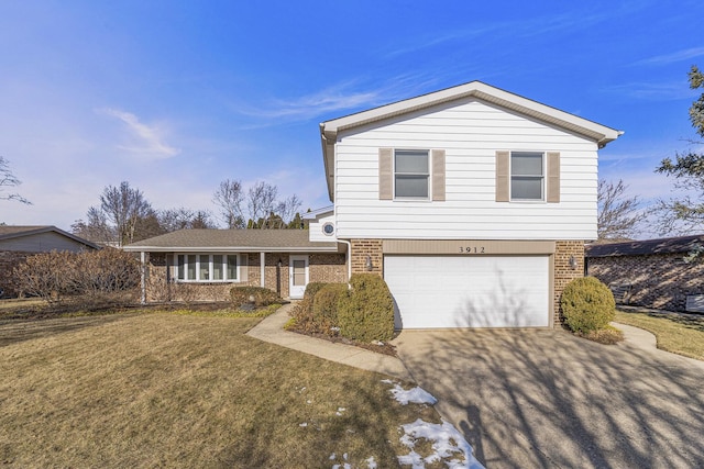 view of front of home with a garage and a front yard