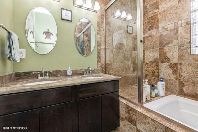 bathroom with vanity and separate shower and tub