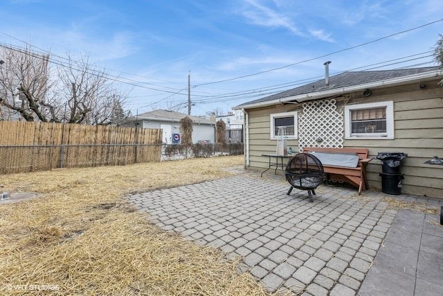 view of patio / terrace with an outdoor fire pit