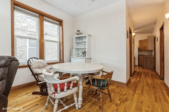 dining space featuring light wood-type flooring