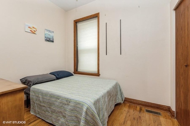 bedroom with light hardwood / wood-style floors