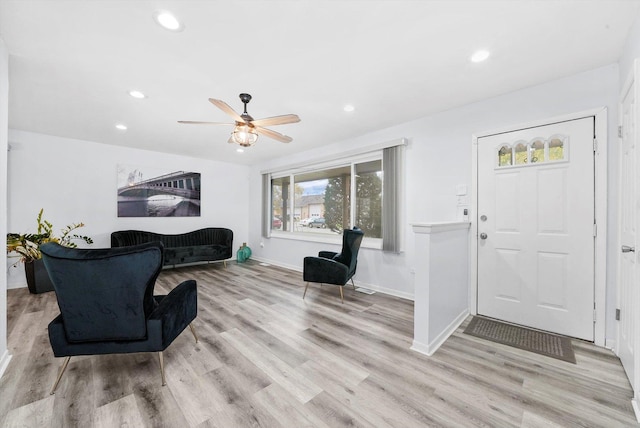 entryway featuring ceiling fan and light wood-type flooring