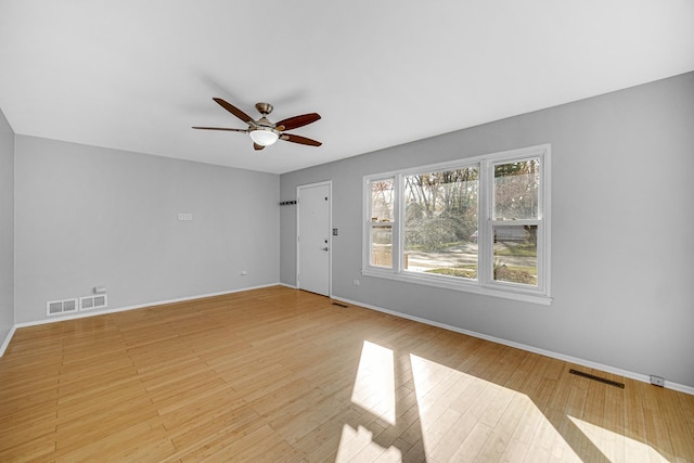 unfurnished room featuring ceiling fan and light hardwood / wood-style flooring