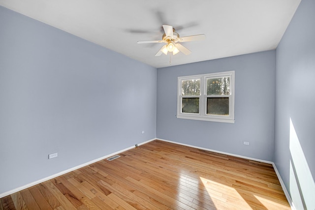 spare room with ceiling fan and light hardwood / wood-style flooring