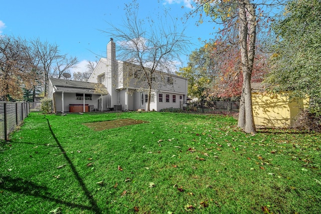 view of yard with a hot tub