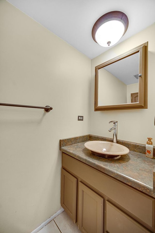 bathroom with tile patterned flooring and vanity