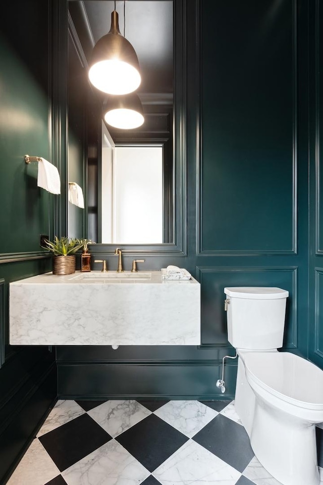 bathroom with sink and toilet