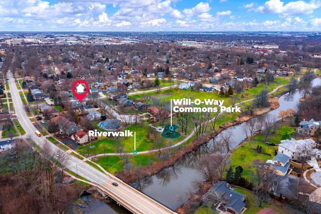 drone / aerial view with a residential view and a water view