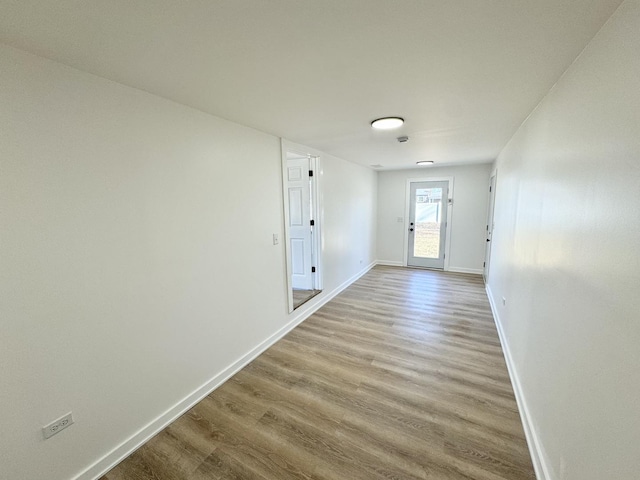 doorway to outside with light wood-type flooring