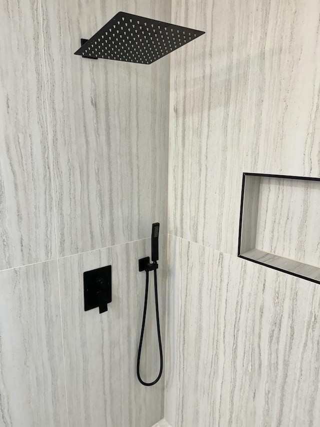 room details with a tile shower