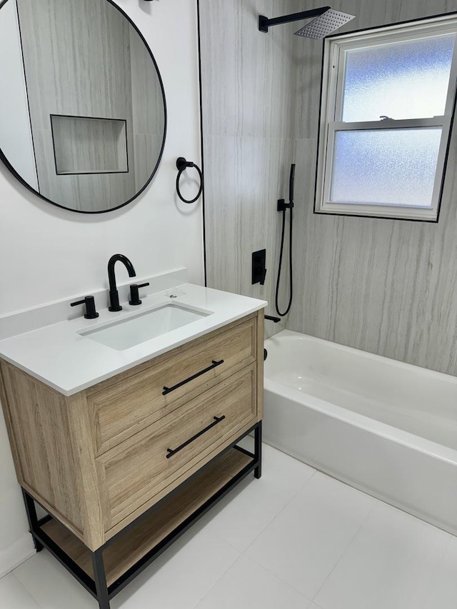 bathroom featuring vanity, tile patterned floors, and tiled shower / bath