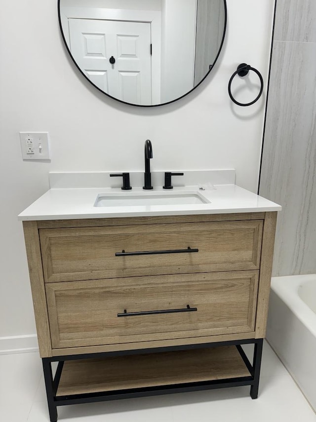 bathroom with vanity and a tub to relax in