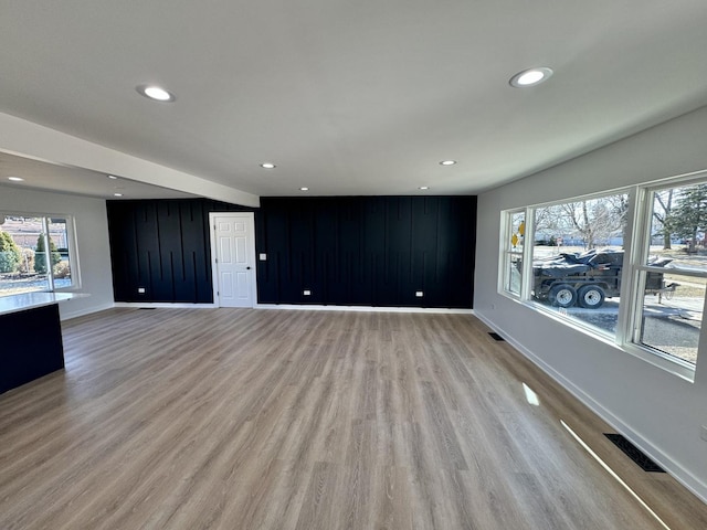 unfurnished living room with light hardwood / wood-style floors