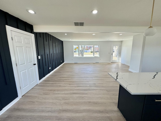 living room with light hardwood / wood-style flooring