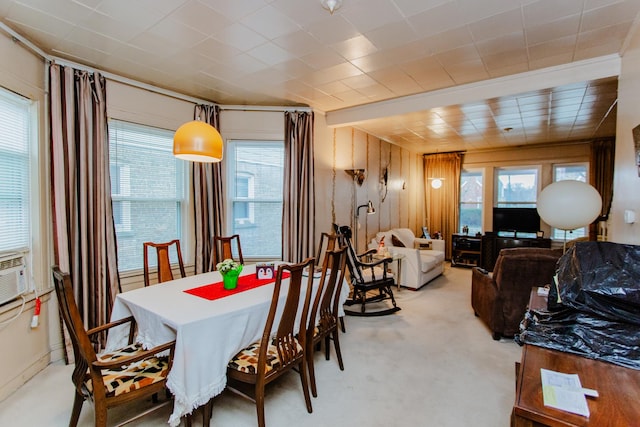 dining room with plenty of natural light and light carpet