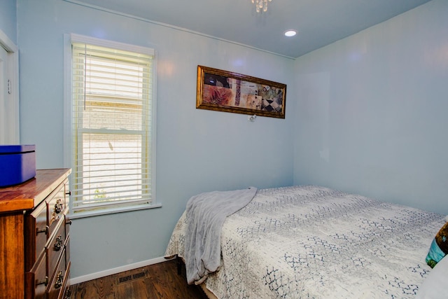 bedroom featuring dark hardwood / wood-style flooring