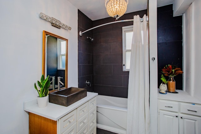 bathroom featuring vanity and shower / tub combo