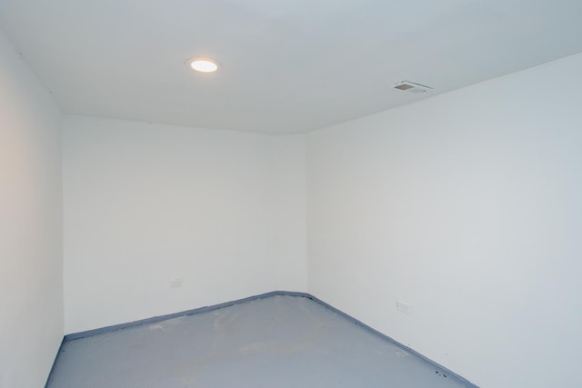 spare room with concrete floors