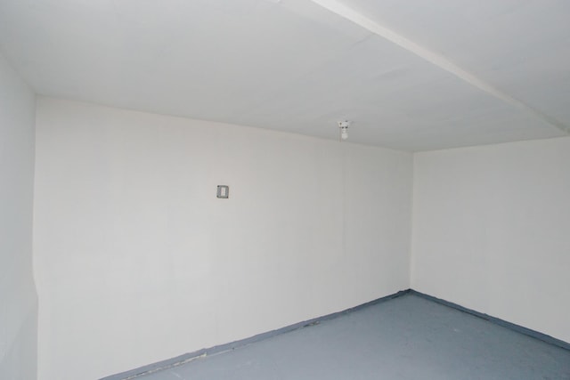 spare room with concrete flooring