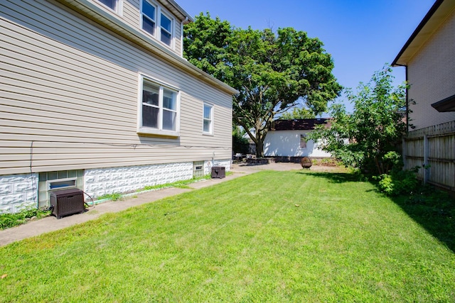 view of yard featuring central air condition unit