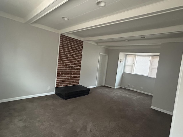 unfurnished living room featuring beam ceiling and dark colored carpet