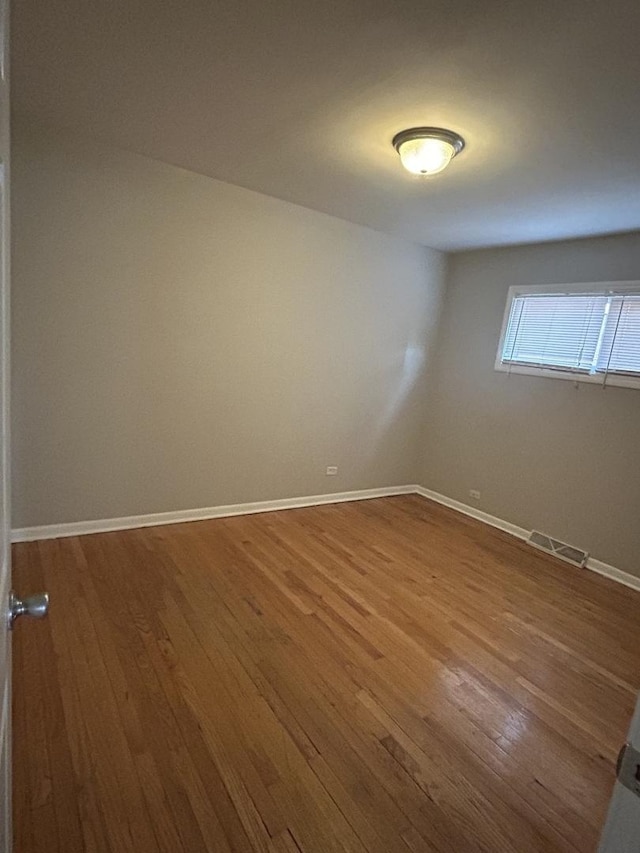 empty room featuring wood-type flooring