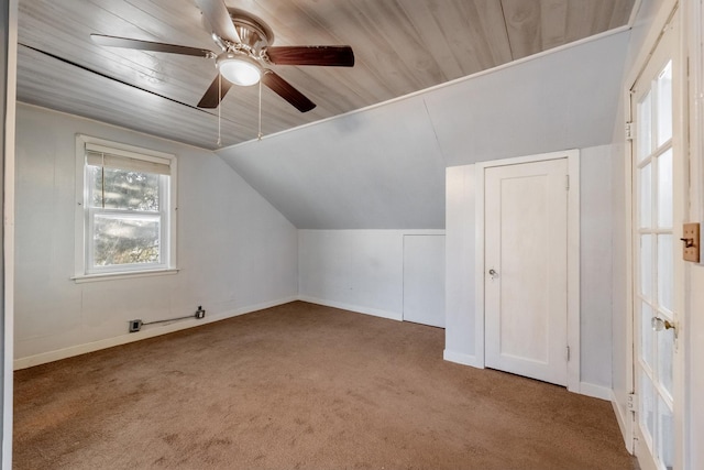 bonus room featuring ceiling fan, lofted ceiling, carpet floors, and wooden ceiling