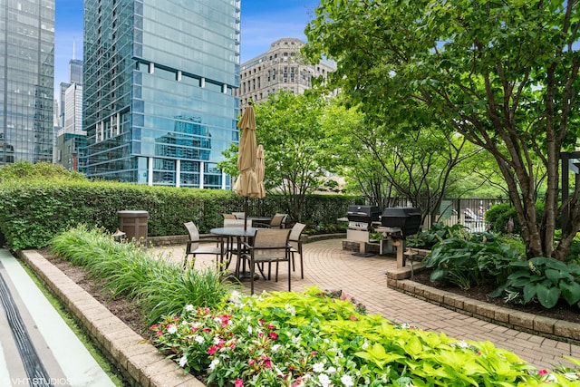 view of home's community with a patio area