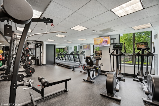 exercise room featuring a drop ceiling