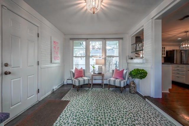 sitting room with an inviting chandelier