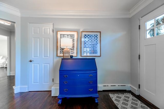 foyer featuring dark hardwood / wood-style flooring, ornamental molding, and baseboard heating