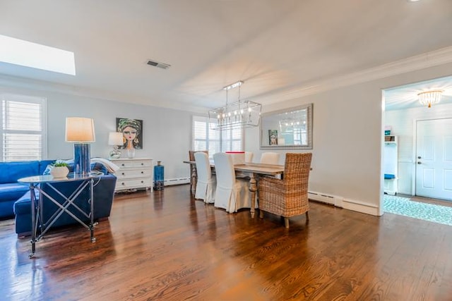 dining space with an inviting chandelier, dark hardwood / wood-style flooring, ornamental molding, and baseboard heating