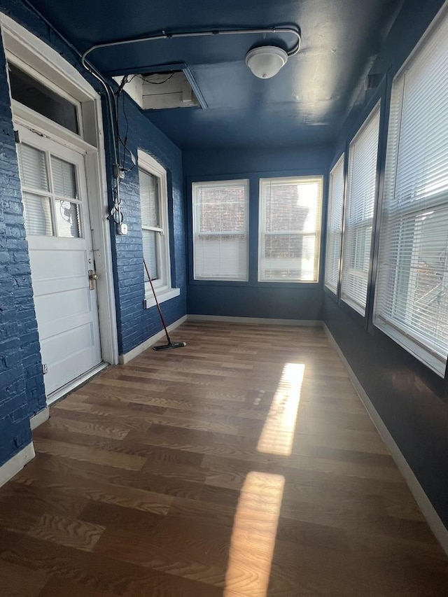 unfurnished sunroom with a wealth of natural light